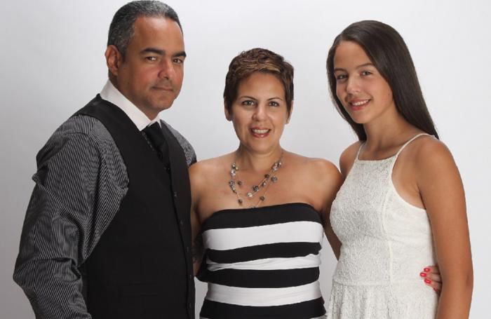 Evelyn Ortiz, Chief Talent Officer at Zoetis, is the company's 2016 Working Mother of the Year. She is pictured here with her husband, Victor and daughter, Rosie. | Zoetis