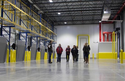Visitors tour Cooper Farms' new cold storage distribution center in St. Henry, Ohio. | Cooper Farms