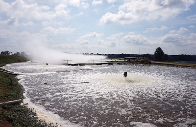 Evaporative cooling pond (background) and LAS irrigation pond (foreground) used to manage waste heat recovery and effluent recycle and disposal. | Courtesy AmPro