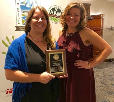 Katie Yost (left) of Montana receives American Agri-Women's LEAVEN award from Kimberly Schmuhl (right), AAW LEAVEN committee chair.