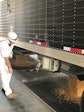 Didion Employee monitors the unloading of corn