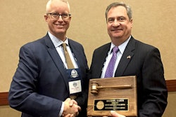 The new MARS President Harry Zander (left) is congratulated by outgoing president Michael Barth, who was honored for his leadership at the 2018 Winter Meeting in January.