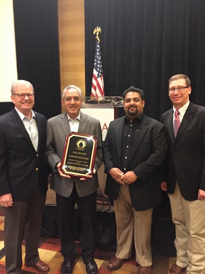 From left: Joel G. Newman, AFIA President & CEO; Joe Saini, Quality Liquid Feeds; Randy Saini, Quality Liquid Feeds; and T.J. Biggs, Global Animal Products, Liquid Feed Committee Chairman. Photo by American Feed Industry Association