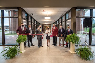 Administrators and partners commemorated the opening of Mississippi State’s Poultry Science Building with a ribbon-cutting ceremony Monday [Nov. 9]. Pictured, left to right, are Gary Jackson, director of the MSU Extension Service; Scott Willard, interim dean of MSU’s College of Agriculture and Life Sciences; MSU President Mark E. Keenum; Mary Beck, poultry science department head; Reuben Moore, in