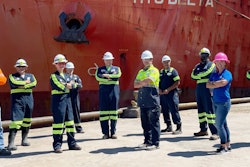 CHS Myrtle Grove, La., employees took a break from recovery efforts to commemorate the first vessel to arrive for loading since Hurricane Ida slammed into the Gulf Coast. Photo: CHS
