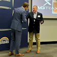 David Toland, Kansas Lieutenant Governor & Secretary of Commerce, presents the Award to Michael Hinton, AgTrax director of Sales & Marketing. Photo: AgTrax