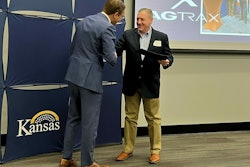 David Toland, Kansas Lieutenant Governor & Secretary of Commerce, presents the Award to Michael Hinton, AgTrax director of Sales & Marketing. Photo: AgTrax