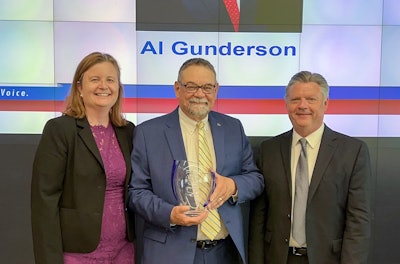 AFIA's Sarah Novak (left) and AFIA 2021-22 Board Chair Mike Schuster (right) present Al Gunderson with the AFIA Distinguished Service Award. Photo: AFIA
