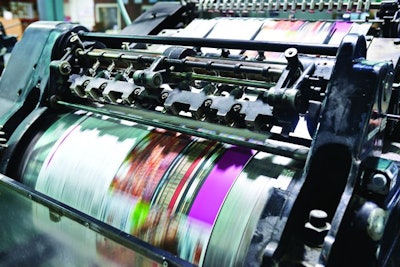 Detail shot of the workings of a printing factory. The commercial designs displayed in this image represent a simulation of a real product and have been changed or altered enough by our team of retouching and design specialists so that they are free of any copyright infringements