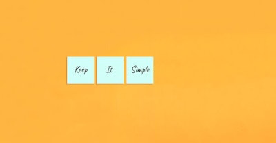 Motivational quote Keep it simple. Handwritten inscription on sticky notes.