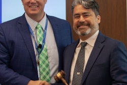 Mike Gauss hands over the reins to Carlos Gonzalez during AFIA's annual board of directors meeting.