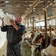 Strong Farmer Carrying Feed Sack