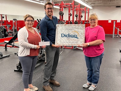Lorena Garcia, Didion administrative assistant (left), and Chris Johnson, Didion executive assistant (right), present a $3,000 check to Wyatt Tramburg (center).