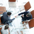 Handshake Across Table