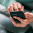 Man On Bed With Laptop And Cell Phone Greta Hoffman Pexels
