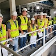 Alex Kerrigan (far right), vice president of project development for Todd & Sargent, guest lectures a group of ISU students at the ISU KENT Feed Mill and Grain Science Complex.