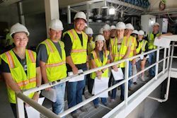 Alex Kerrigan (far right), vice president of project development for Todd & Sargent, guest lectures a group of ISU students at the ISU KENT Feed Mill and Grain Science Complex.