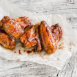Baked Chicken Wings On Wooden Table
