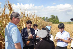 Last week, the U.S. Grains Council (USGC) sponsored a team of new Japanese feed grain purchasers that toured the U.S. corn value chain to build their understanding and trust in how U.S. corn is grown and shipped. Pictured, group participants speak to Missouri Corn Merchandising Council Board Member Brian Willott (leftmost) on his farm to learn about his operation and the upcoming harvest.