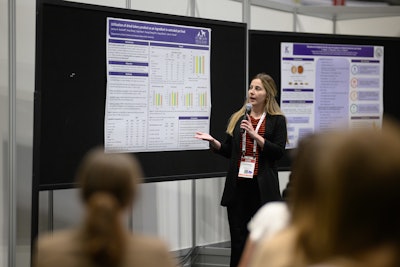 A student gives their research presentation at Petfood Forum.