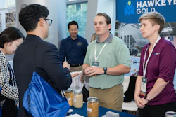 Survey results from Export Exchange 2024 show 968,030 metric tons of U.S. agricultural products were sold during or immediately after the event. Pictured, attendees speak with representatives from U.S. Grains Council member Hawkeye Gold about its products and services.