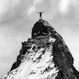 Success Man Reaches Mountaintop