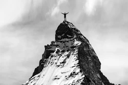 Success Man Reaches Mountaintop