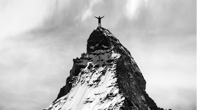 Success Man Reaches Mountaintop