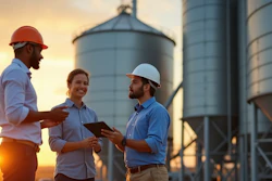 Workers Talking At Grain Elevator