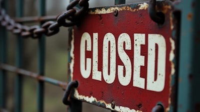Closed Sign On Chained Shut Fence