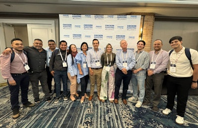 U.S. Grains & BioProducts Council's Marketing Specialist Angélica Ríos (fifth from right) and USGBC Regional Consultant Alejandro Gonzalez (fourth from right) recently led a team of Latin American poultry industry stakeholders to the 2025 Chicken Marketing Summit in Savannah, GA.