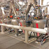 Industrial processing equipment with metal tanks and interconnected machinery