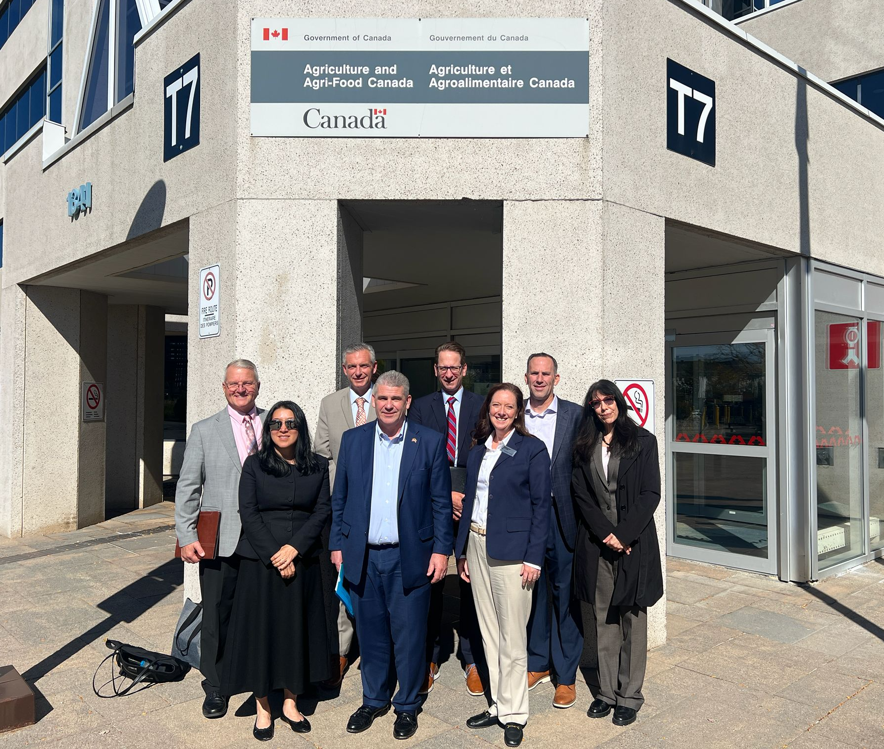 Pictured from left to right outside the offices of Agriculture and Agri-Food Canada are (rear) Ohio Corn & Wheat Growers Association Executive Director Tadd Nicholson; Kansas Corn CEO Josh Roe; Minnesota Corn Growers Association Executive Director Adam Birr; Nebraska Corn Board Executive Director Kelly Brunkhorst; USGBC Regional Ethanol Manager for the European Union, United Kingdom and Canada Stephanie Larson; (front) South Dakota Corn Executive Director DaNita Murray; USGBC Vice President Cary Sifferath; and Indiana Corn Marketing Board CEO Courtney Kingery.