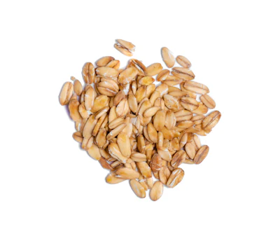 Pile of golden wheat or grain seeds on white background