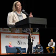 (Top) FDA’s Jenny Murphy provided a timely update on key regulatory issues impacting the pet food sector. (Bottom) A panel explored how artificial intelligence is shaping everything from recipe design to kibble production.