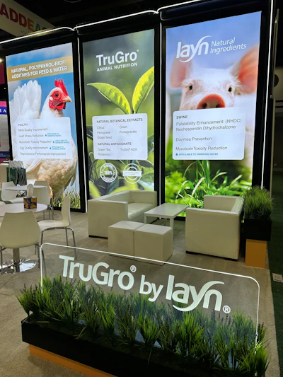 TruGro trade show booth highlighting animal nutrition solutions with green and white panels