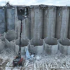 The demolition of 146 concrete silos in Lincoln, Nebraska, is slated to be completed by the end of 2026. The high-reach demolition excavator extends 120 feet, enabling a safer structure removal from the top to bottom.