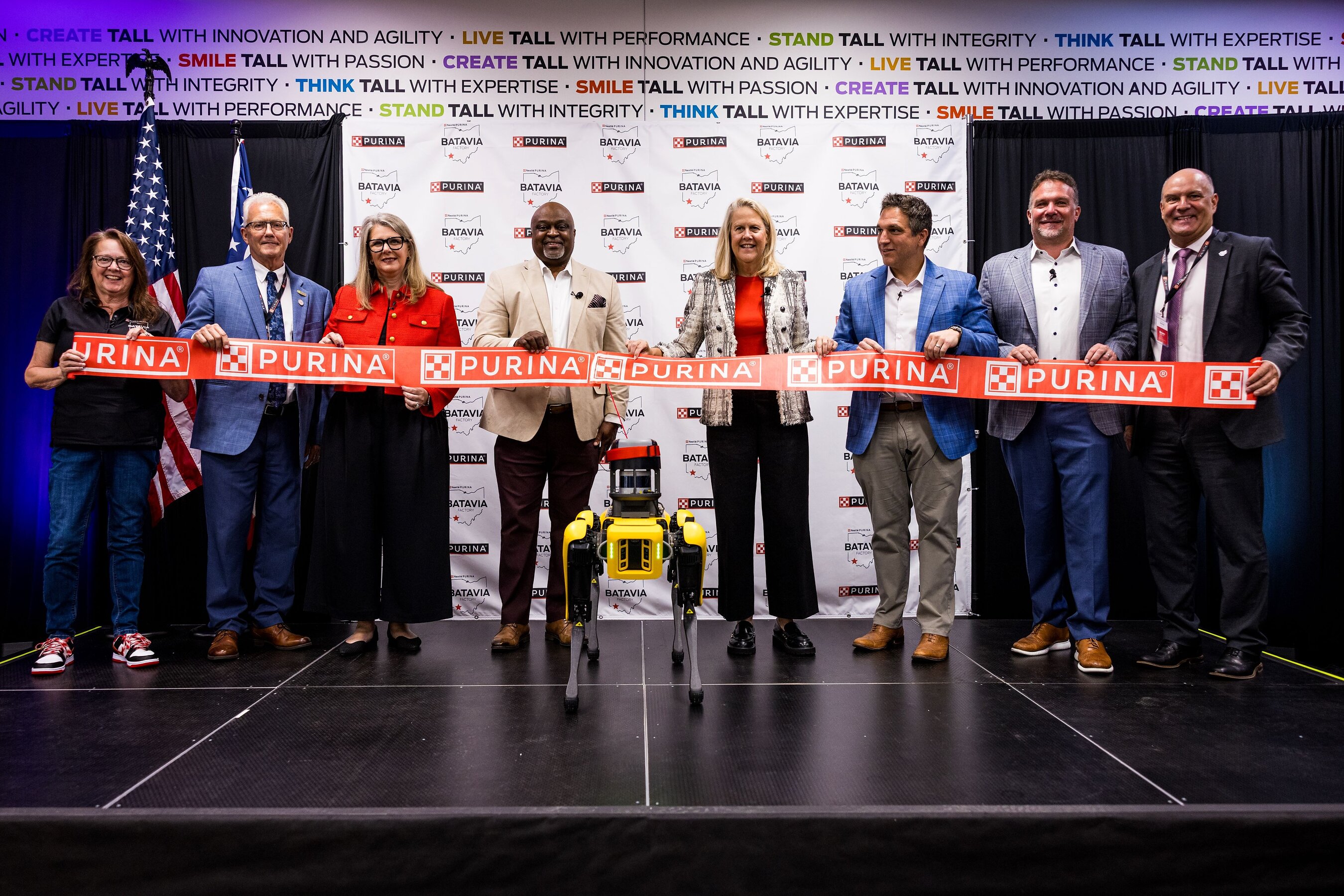 Purina ribbon-cutting ceremony with executives and officials at corporate event