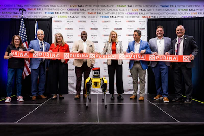 Purina ribbon-cutting ceremony with executives and officials at corporate event