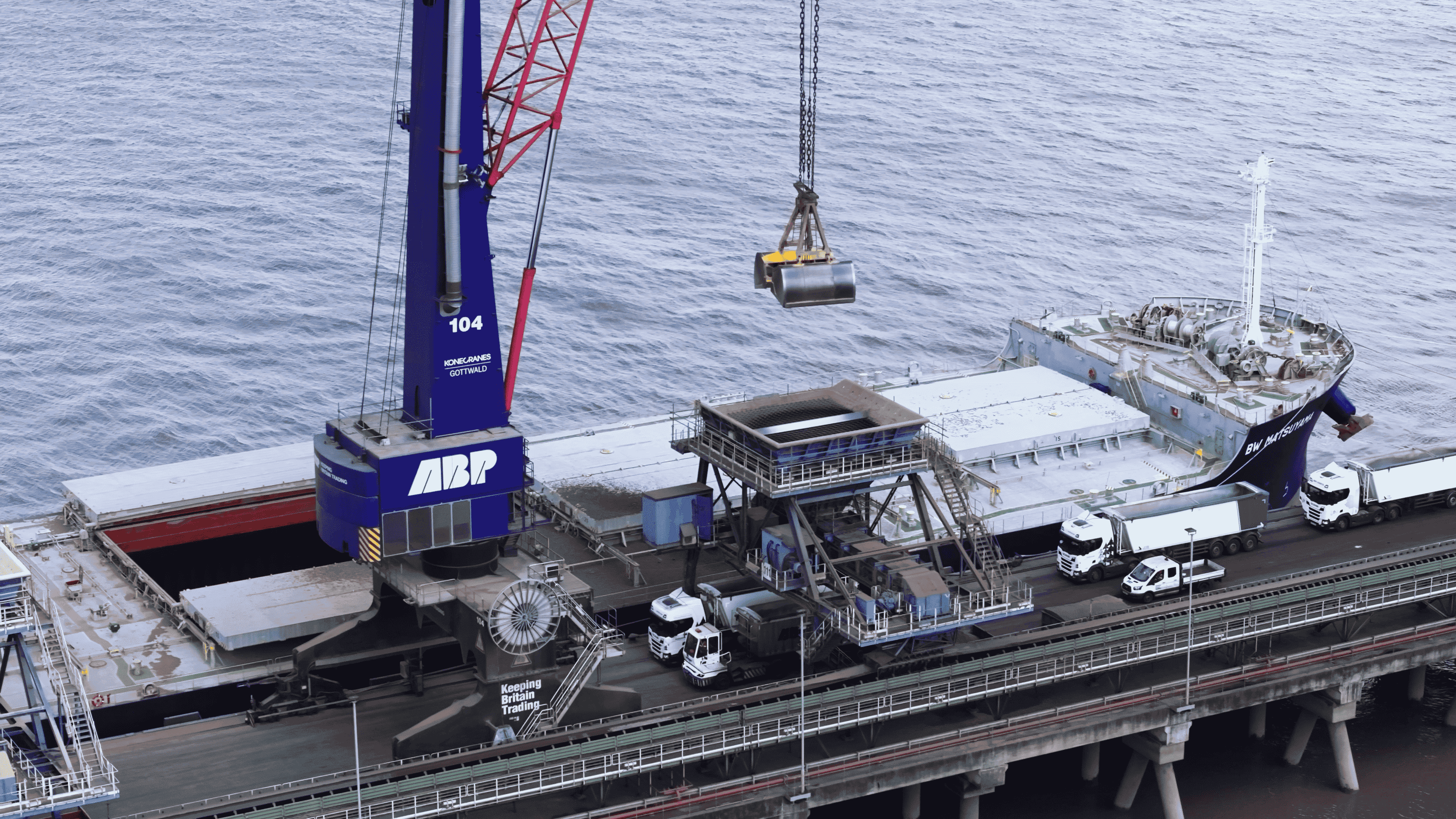 ABP industrial crane and port equipment loading cargo vessel at dock