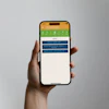 Hand holding smartphone displaying green and blue app interface with navigation menu