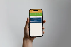 Hand holding smartphone displaying green and blue app interface with navigation menu