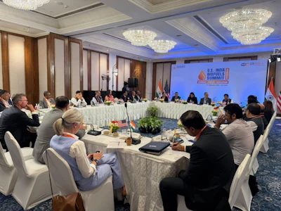 U.S.-India Biofuels Summit conference meeting with diplomats and officials seated around table